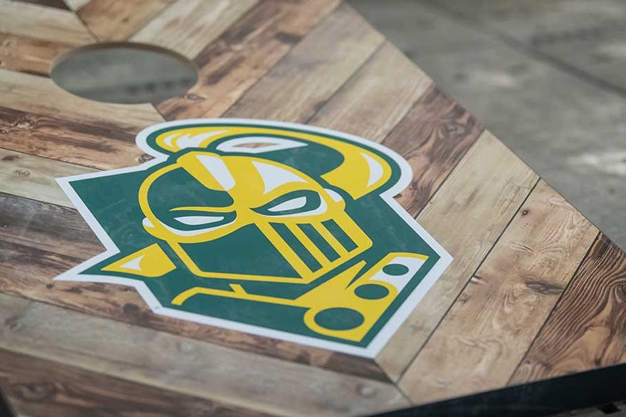 Corn hole board with the Clarkson logo on it